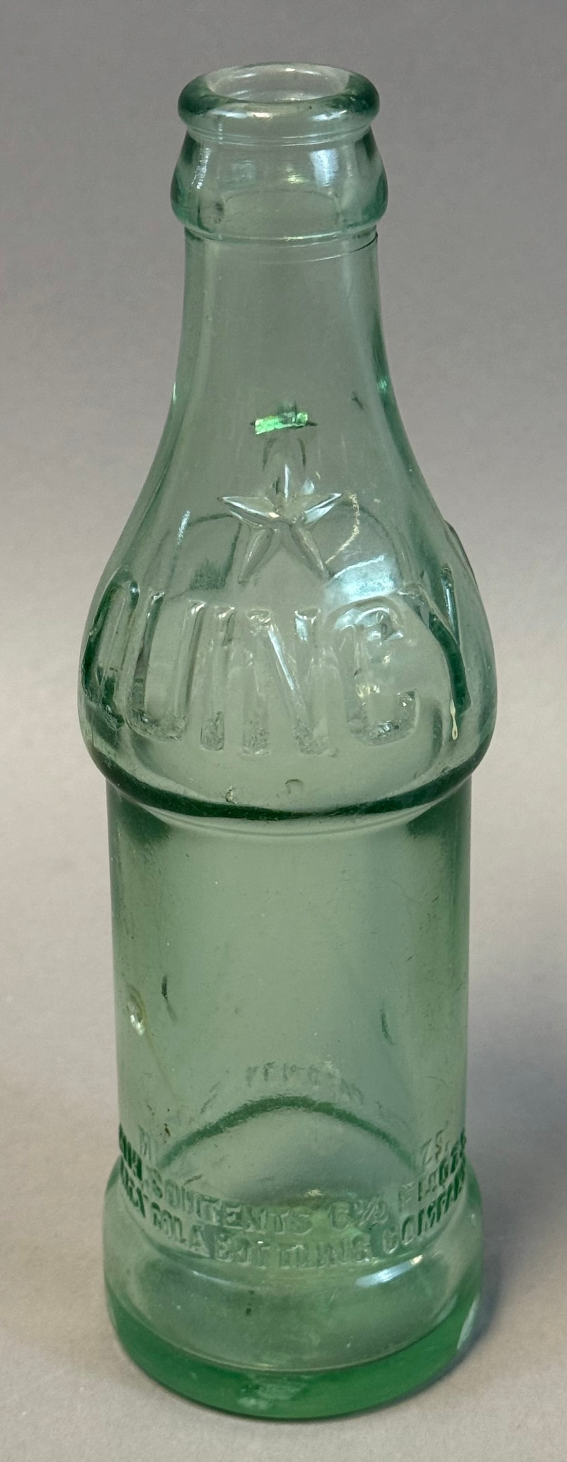 Quincy FL Straight Side Coca Cola Bottle Florida Star 6.5oz Early Coke: Early straight-sided Coca-Cola bottle embossed ?Florida? with star and ?Quincy, Fla? on base, marked 6 1/2 fluid ounces and property of Coca-Cola Bottling Company, dating to circa 1910?1916 pre-contou
