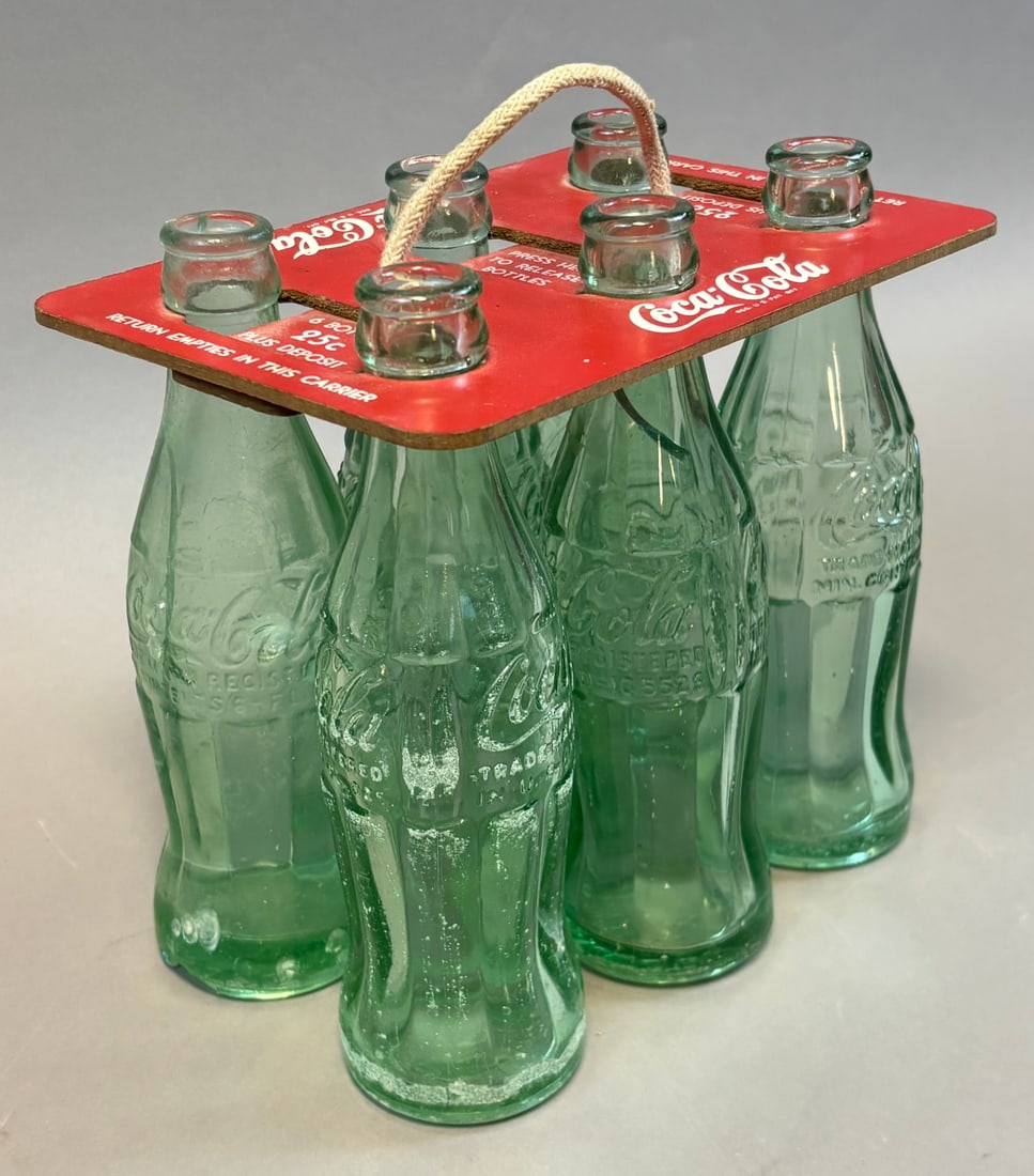 Coca-Cola 6 Bottle Cardboard Carrier w Embossed Coke Glass Bottles: Vintage Coca-Cola six-pack cardboard carrier with original red top panel featuring ?6 Bottles 25? Plus Deposit? and ?Press Here To Release Bottles? instructions, complete with six embossed green glass