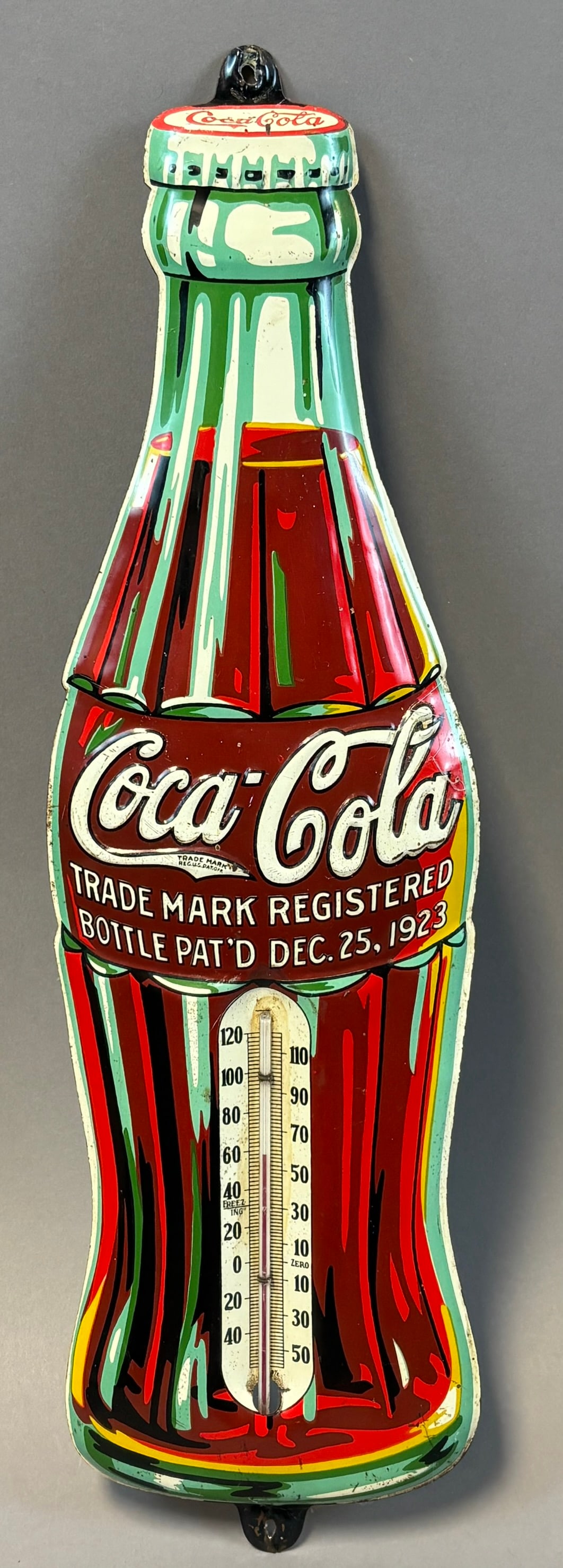 Coca Cola Tin Bottle Thermometer Sign Pat?d Dec 25 1923 Advertising: Vintage Coca-Cola bottle form tin advertising thermometer featuring the iconic contour bottle design with ?Trade Mark Registered Bottle Pat?d Dec. 25, 1923? script across the center, likely mid-20th c