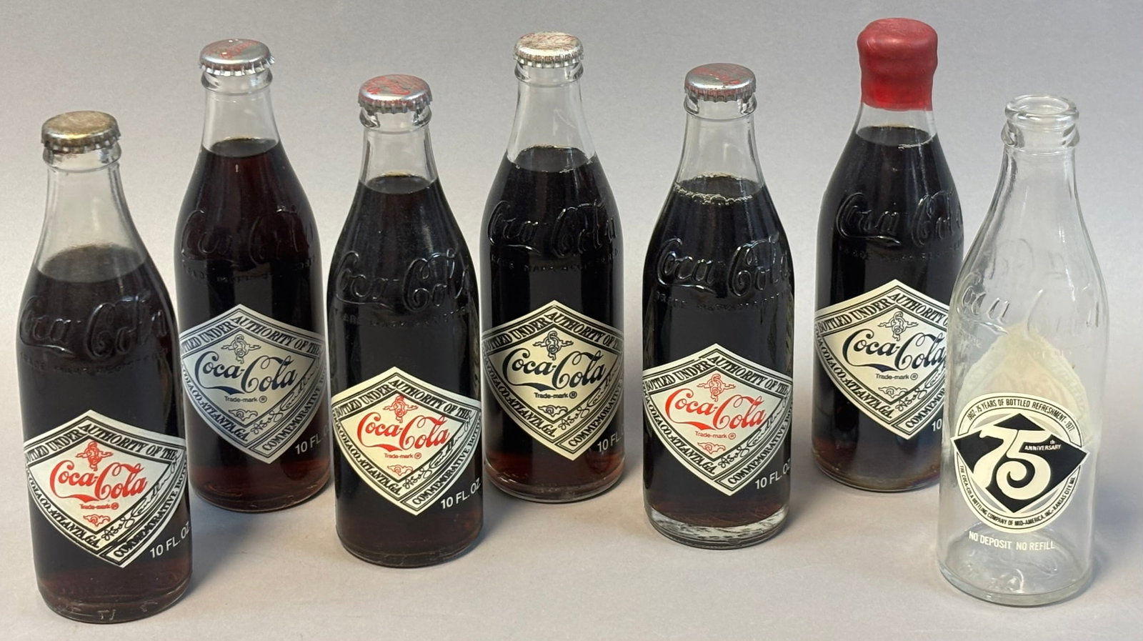 Lot 7 Coca Cola 10 Oz Glass Emboxxed Bottles FULL & Sealed 75th Anniversary: See all photos
