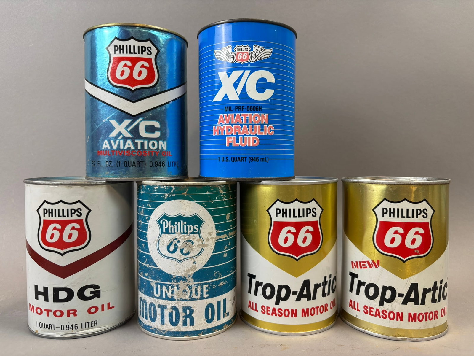 6 Phillips 66 XC Aviation & Hydraulic Trop Artic Composite Metal Full Quart Cans: Top two cans are full - XC Hydraulic is metal - rest are empty