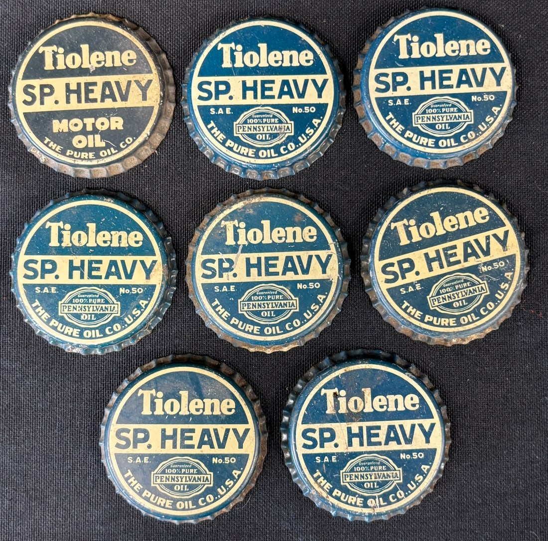Lot 8 Tiolene SP Heavy The Pure Oil Co Metal Oil Bottle Caps: Great original graphics. Wear as shown. See all photos for a better idea on condition.
