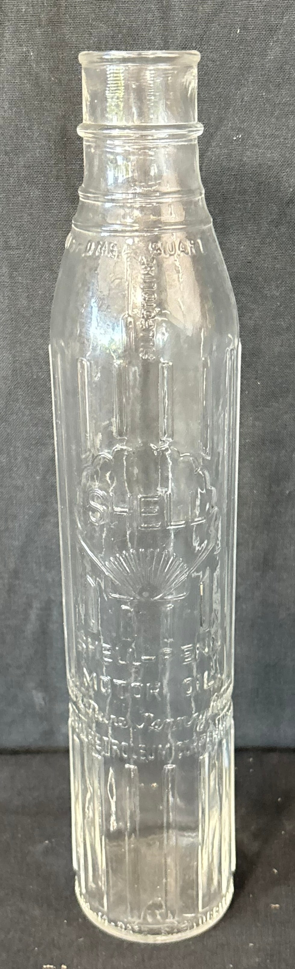 Shell Penn Embossed Glass 1 Quart Motor Oil Bottle: Great original graphics. Wear as shown. See all photos for a better idea on condition.