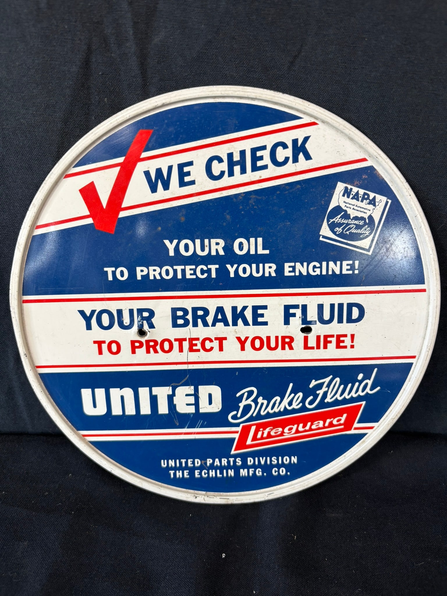 We Check Your Brake Fluid NAPA SST Painted Metal Rack Sign: 10" diameter