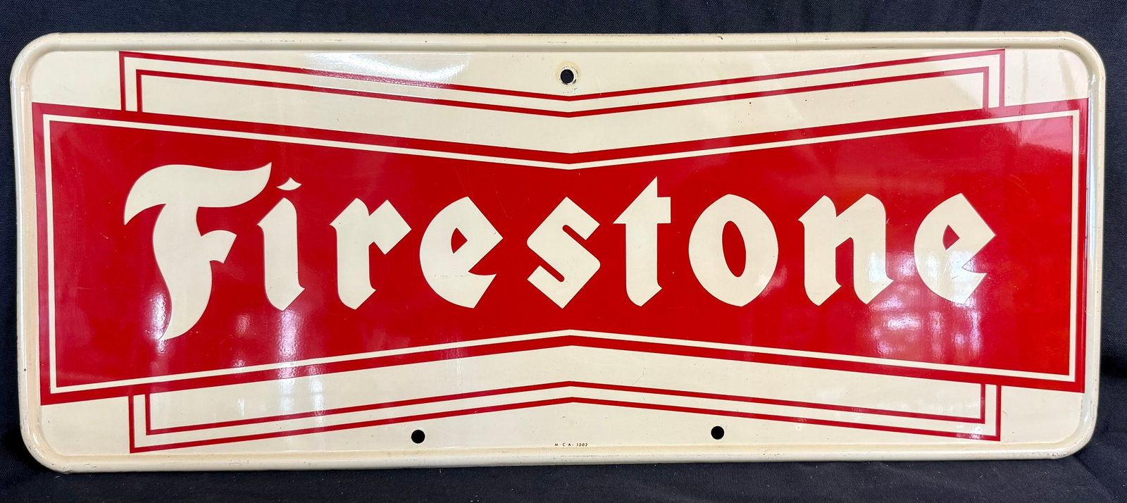 Firestone SST Metal Self Framed Bowtie Tire Advertising Sign: Measures 25" x 10" - great original sign, marked M.C.A. 1502
