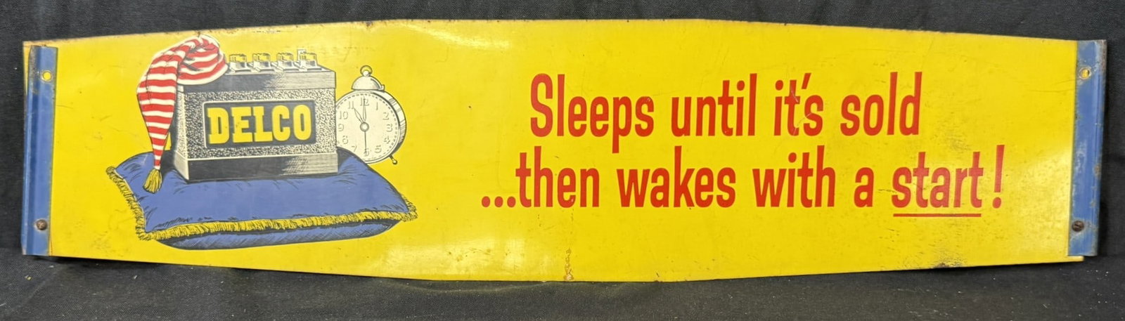 Delco Battery DST 2 Sided Painted Metal Advertising Sign: Measures 25" x 6"