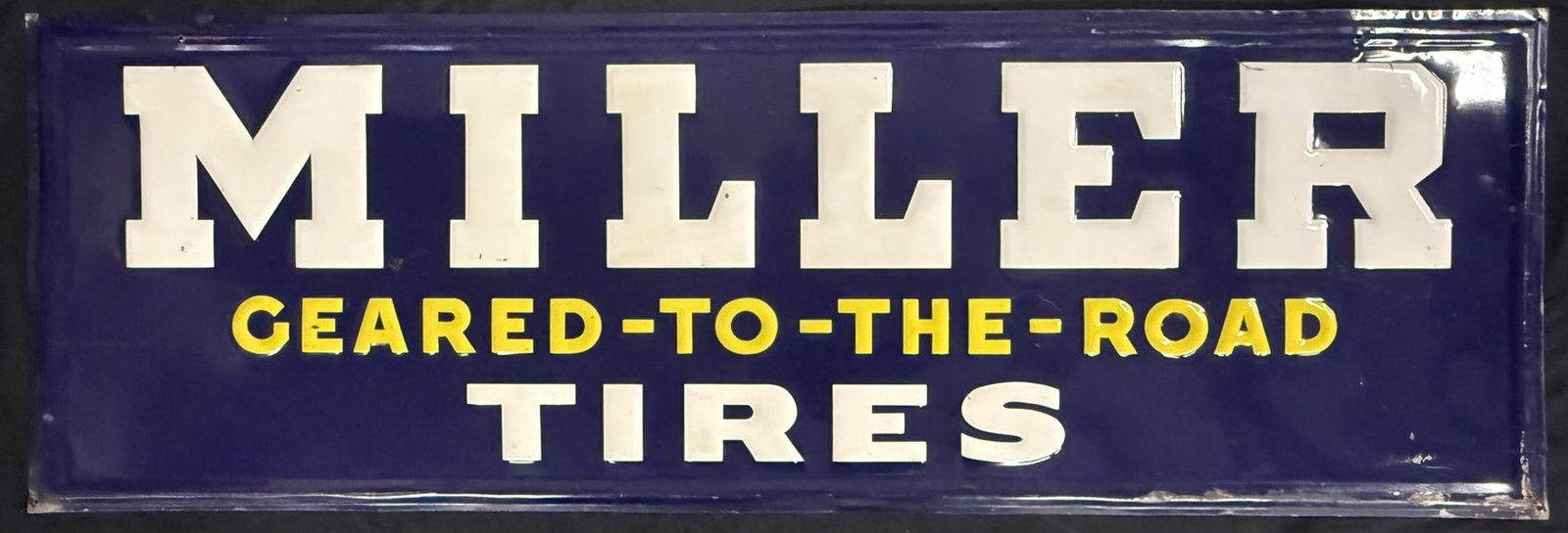 Miller Tires Geared-To-The-Road SST Tin Embossed 5' Sign: Measures 59.75" x 19.75" tall