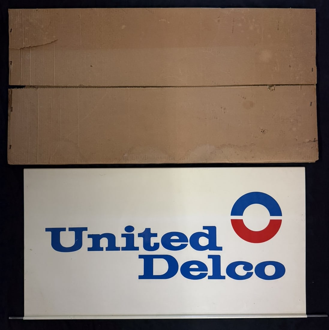 NOS United Delco DST Painted Metal Hanging Sign w/ Box: Measures roughly 19.5" x 30" (Not including swinging bar) - 38" wide overall