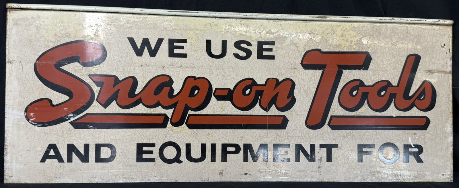 We Use Snap-On Tools Equipment Painted Metal Hanging Sign: Marked bottom right SS-312-A - 32" x 12"