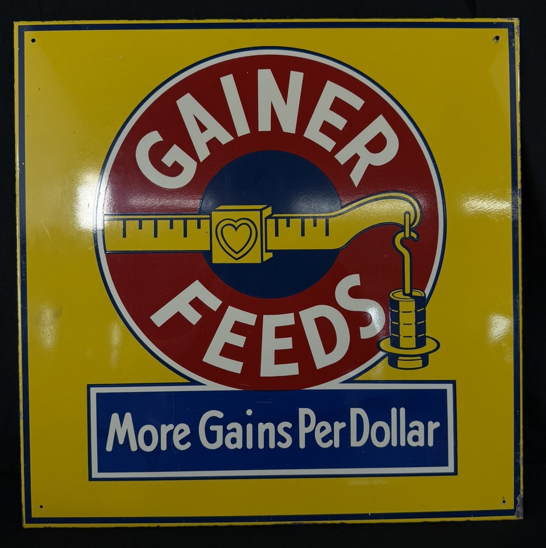 Gainer Feeds More Gains Per Dollar Painted Metal Farm Sign: 20" x 20"