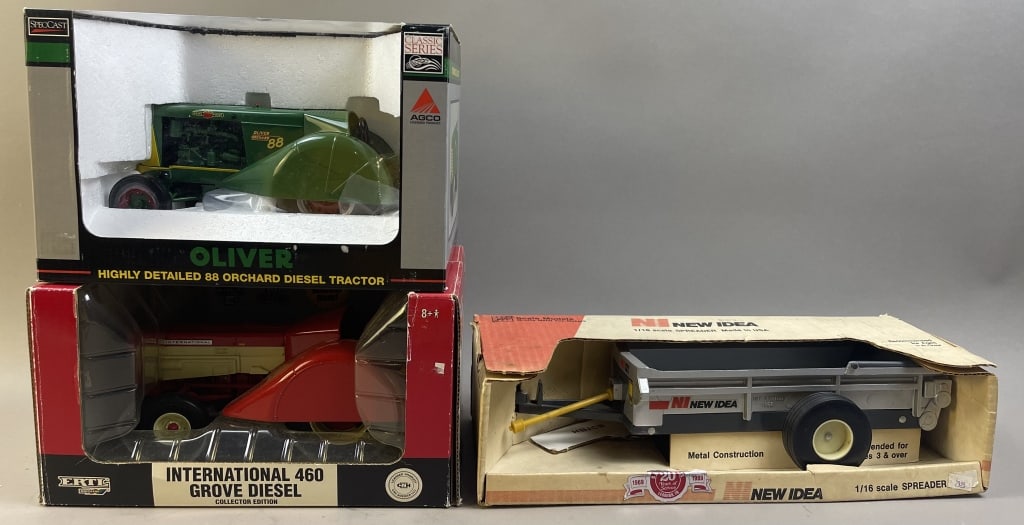 Two 1/16 Scale Model Tractors & Spreader Implement: Please make sure you view all photos and ask any questions you may have! Great original collectible item. This is day 1 of our 2 day one owner auction event. Thanks and have a great day! Holler &