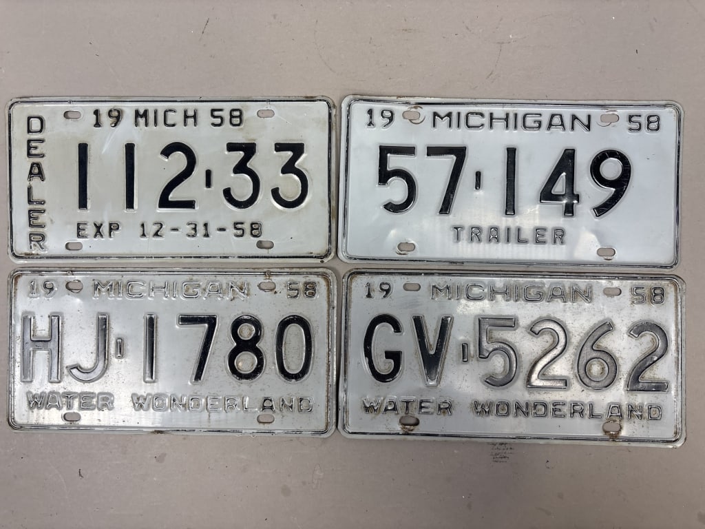 Lot 4 1958 Michigan Dealer Trailer License Plates: See all photos as a better idea of condition.