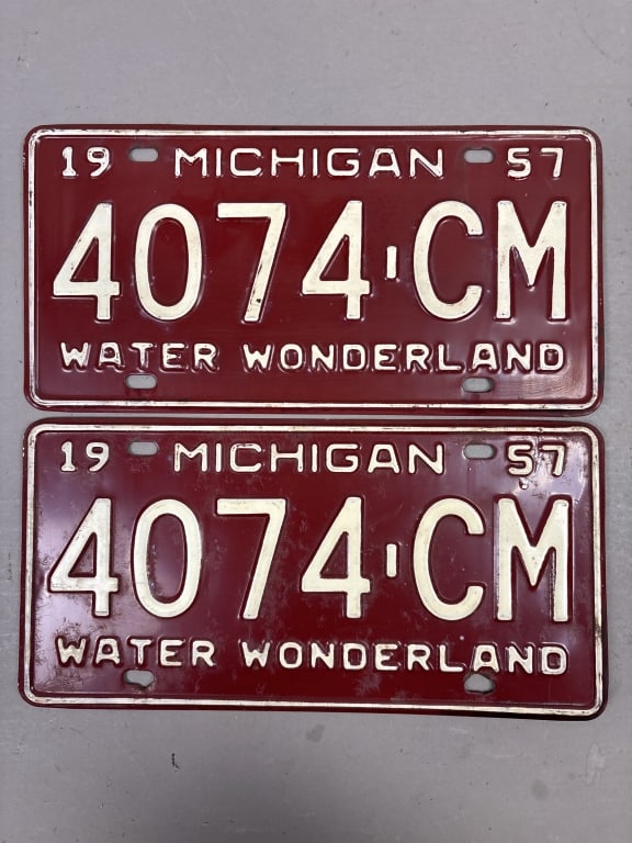 Pair of 1957 Michigan 4074-CM License Plates: See all photos as a better idea of condition.