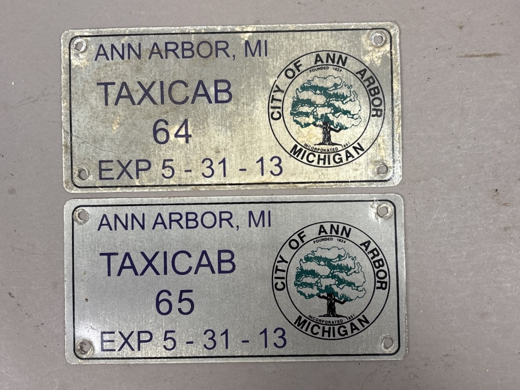 Pair Ann Arbor Michigan Taxicab Exp 5-31-13 Plates: See all photos as a better idea of condition.