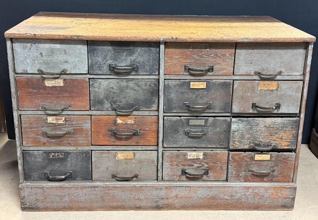 16 Drawer Galvanized Heller Hardware Cabinet: Great original galvanized drawer heller hardware cabinet. Great patina. Light wear to bottom right of wood that?s missing as shown. 50.5" wide x 25.75" deep x 32.5? tall - drawer fronts are 12? x 6?
