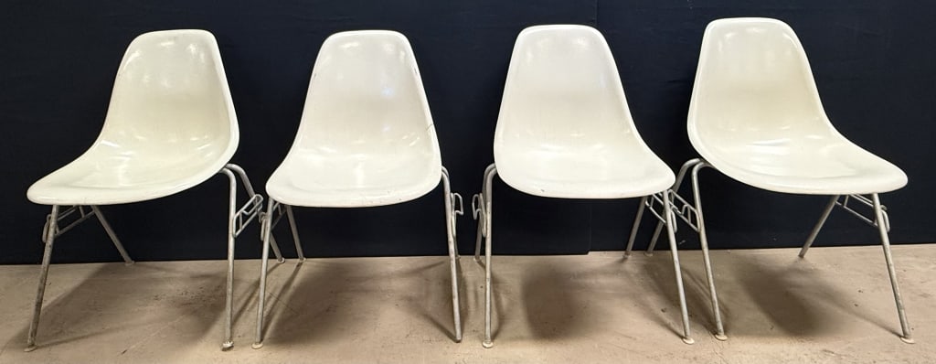 4 MCM Herman Miller White Cream Stacking Chairs: Here is a wonderful lot of four matching Herman Miller white shell chairs. Chairs came out of the Ingham intermediate school district. Light rust to the metal as shown. Minimal fiberglass damage overa