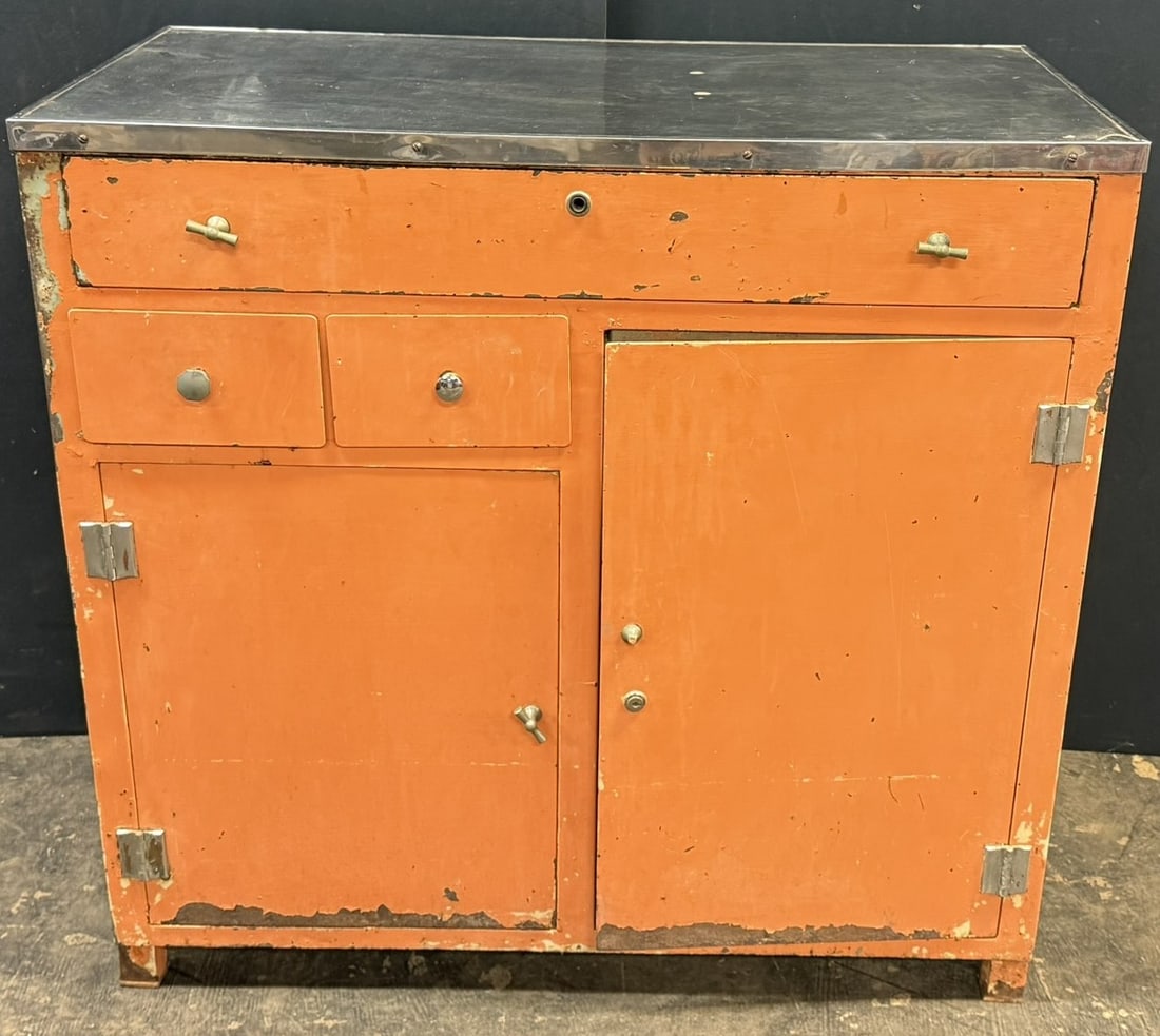 MCM 60s Pumpkin Painted Metal Medical Dental Cabinet: Great original cabinet. One handle knob broken on large bottom right door. 38 inches wide x 20 inches deep x 36 inches tall. Nice stainless steel top.