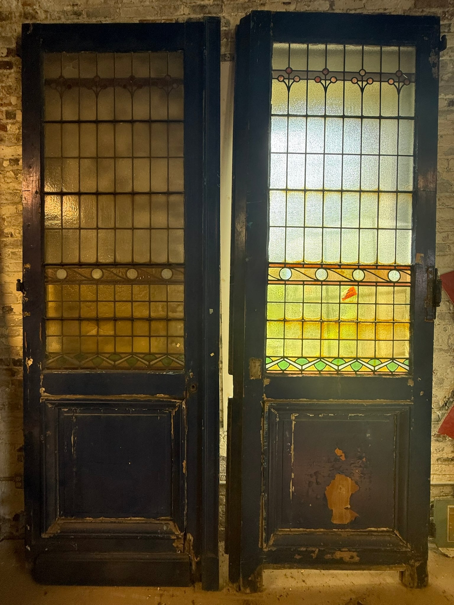 Antique Pair Georgian 10.5' Tall Stained Glass Mansion Doors: These are absolutely iconic and beyond incredible in person. They measure 10 foot 6 inches tall x 45 inches wide x 2.5 inches thick. Obvious wear as shown.