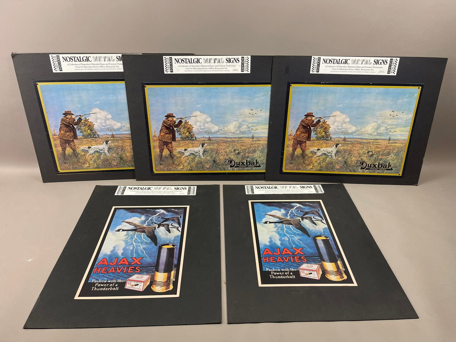 Lot of 5 Nostalgic Metal Signs Ajax Heavies Duxbak: Measurements in photos PLEASE NOTE WE OFFER IN HOUSE SHIPPING & HAVE BIDDING AVAILABLE ON OUR OWN WEBSITE! If you win on LIVE AUCTIONEERS, please click "SELF ARRANGED SHIPPING" and keep on the lookout