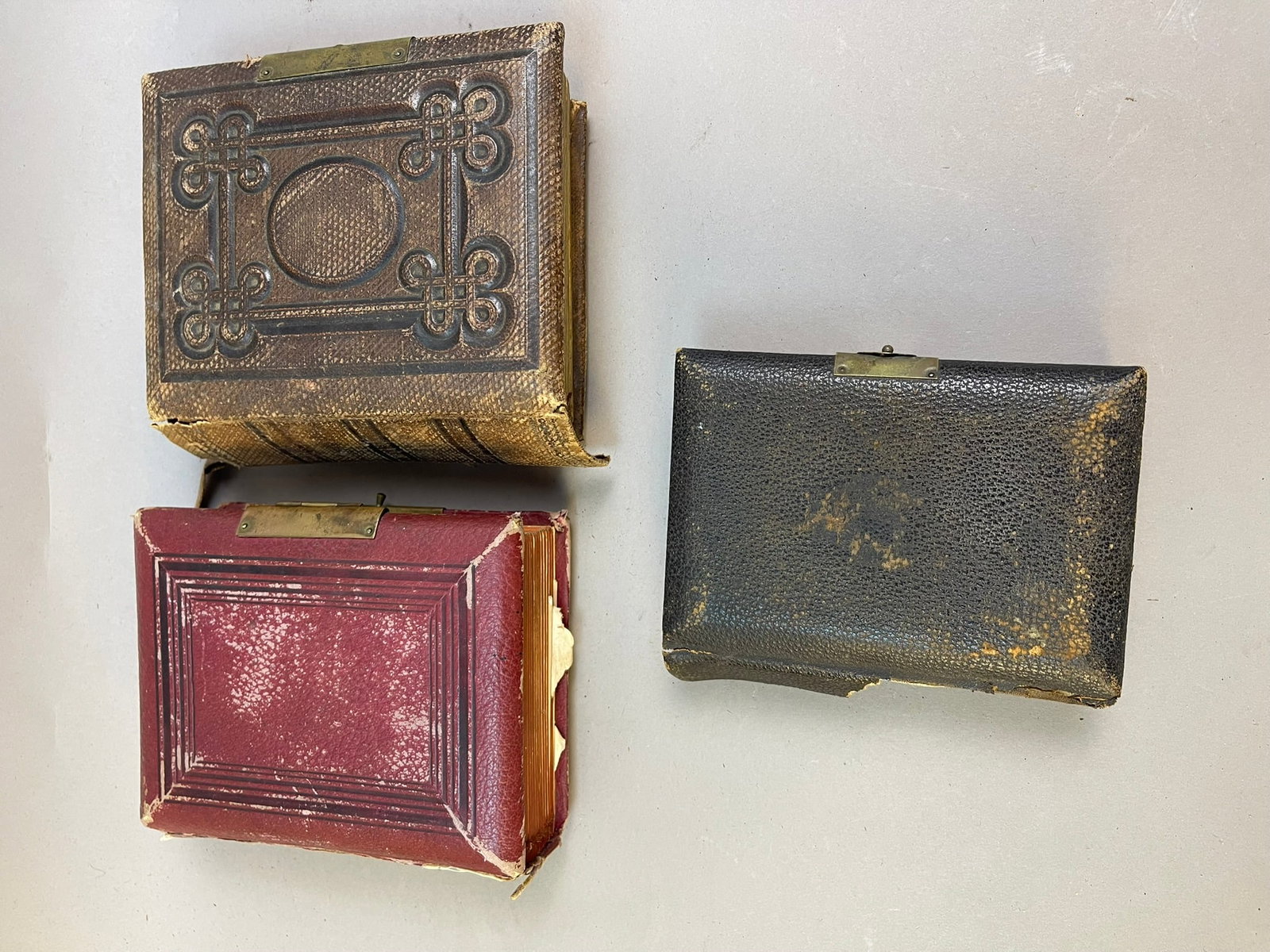 Lot of 3 Antique Photo Albums with Family Pictures: Measurements in photos PLEASE NOTE WE OFFER IN HOUSE SHIPPING & HAVE BIDDING AVAILABLE ON OUR OWN WEBSITE! If you win on LIVE AUCTIONEERS, please click "SELF ARRANGED SHIPPING" and keep on the lookout