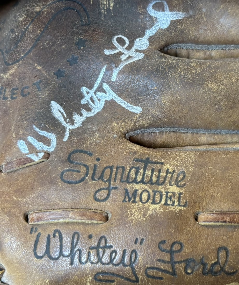 Whitey Ford Signed Spalding 42-241 Baseball Glove: Great original spalding model Whitey Ford right handed throwing glove signed in a nice strong silver ink. Autograph was obtained in person. Excellent glove overall.