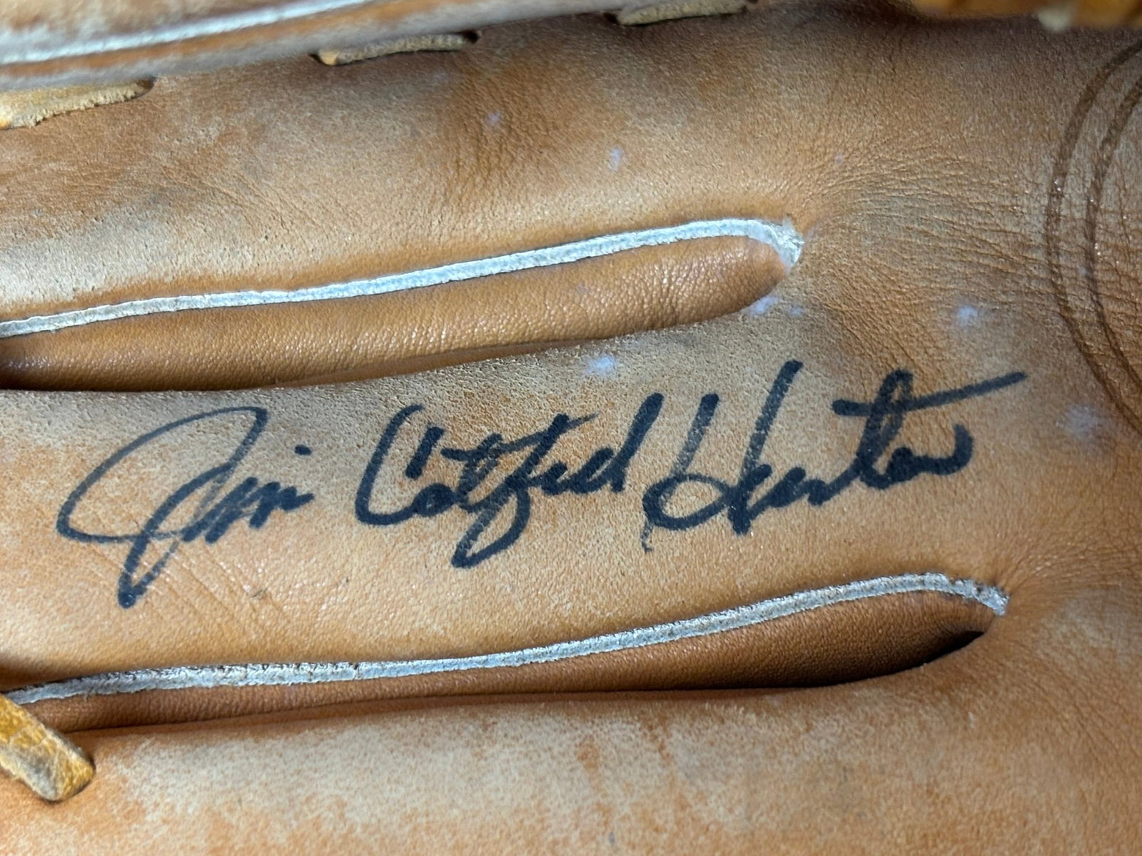 Jim Catfish Hunter Wilson Signed Baseball Glove: Ink on the wriststrap as shown. Signed original Jim Catfish Hunter Model A2162 left handed throwing mitt. Signatures in strong black.