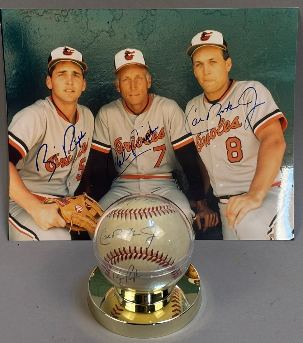 Bill Cal Ripken Jr Sr Signed Baseball & 8x10 Photo: Great original pairing of 8x10 photo & baseball by Billy Ripken, Cal Ripken Jr & Sr on a Bobby Brown Rawlings OAL ball.