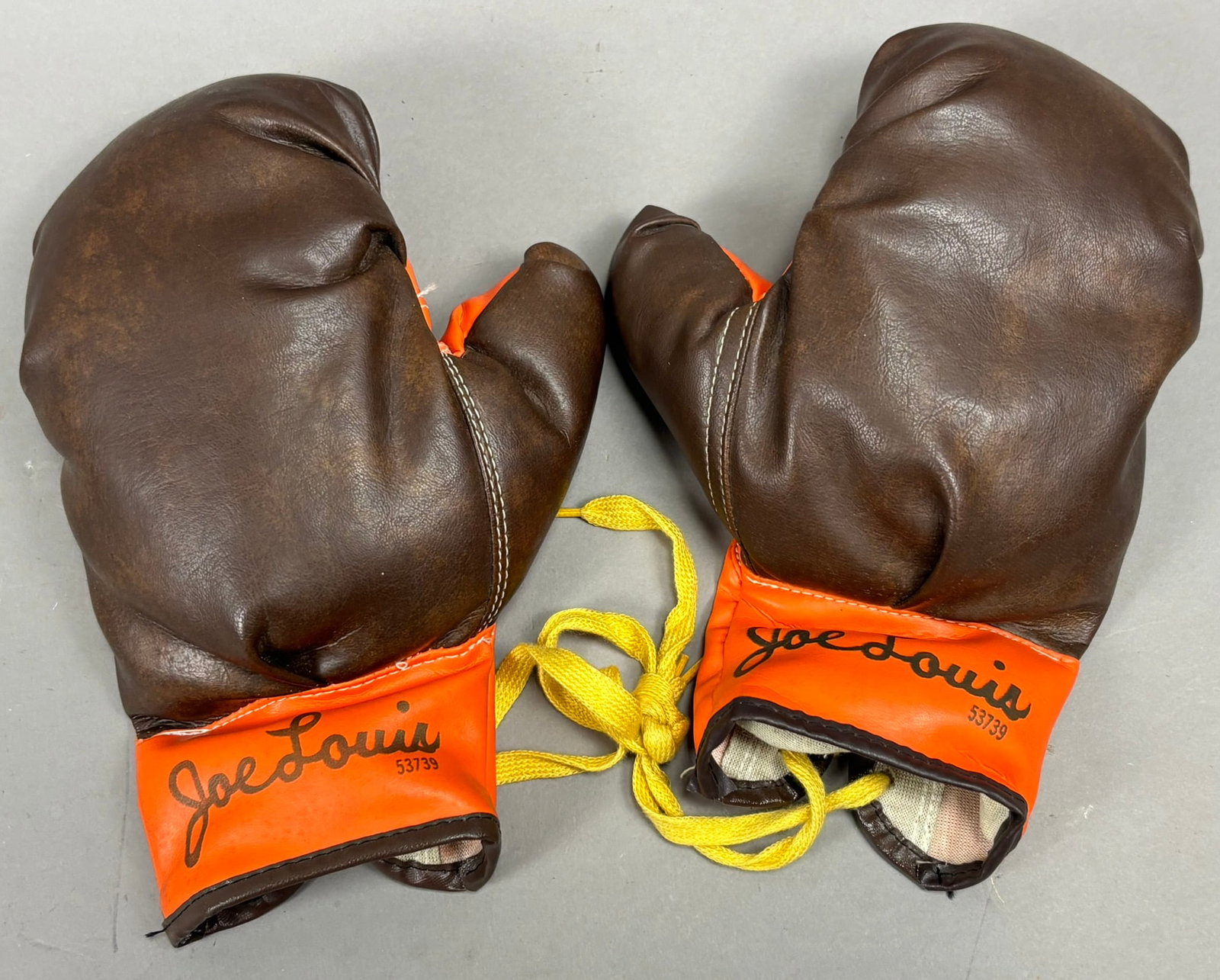Joe Louis Pair 53739 Original Boxing Gloves EX+: PLEASE SEE ALL PHOTOS AND USE THEM AS A BETTER IDEA ON DESCRIPTION! ASK ANY QUESTIONS! PLEASE NOTE WE OFFER IN HOUSE SHIPPING & HAVE BIDDING AVAILABLE ON OUR OWN WEBSITE! If you win on LIVE AUCTIONEER