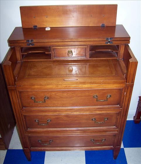 Flip top desk with draws: Flip top desk with draws leather writing top 16" x 26 1/2" x 34" - brass hardware - light in color solid wood very nice piece
