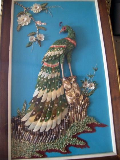 Peacock picture - made of cut seashells: Peacock picture - made of cut seashells framed in wood with plastic covering to keep clean 19 1/2 by 33 1/2 - great details - 3 D multi color and types of shells