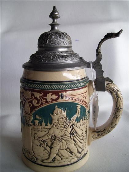 German stein - .05 L - green brown: Unmarked German stein - .05 L - green brown with 3 scenes - kings drinking beer - 8 1/2" metal dome lid - lion thumb lift