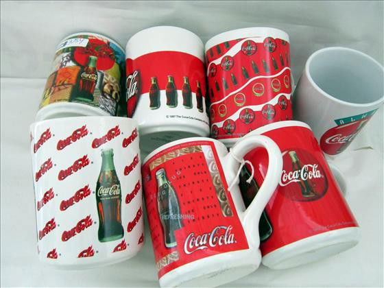 7 Coke coffee mugs - 1997: 7 Coke coffee mugs - 1997 - by Gibson - 4 1/2" different designs