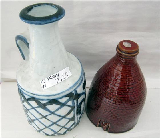2 pc - Stoneware bottle: 2 pc - Stoneware bottle with handle cobalt design - 8 1/4 unmarked - brown silo type ban k - 6 1/2" little man in entry way