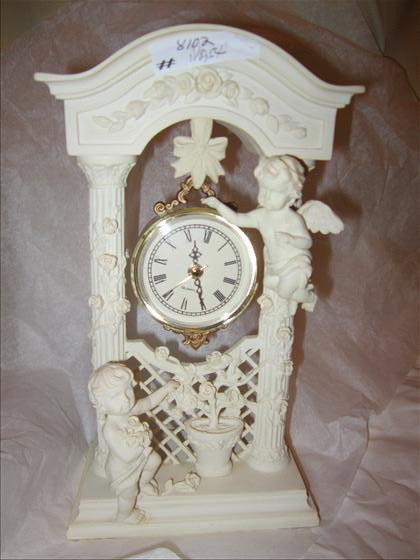 Cherub composite standing clock: Cherub composite standing clock with hanging time piece with roman numbers - quartz - 9" - ivory and gold in color in archwa