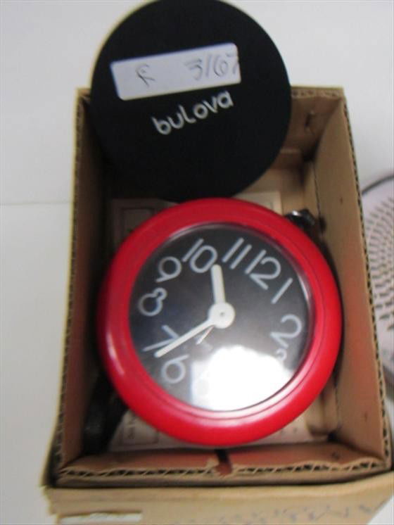 Bulova clock in box red plastic: Bulova clock in box red plastic Americana collection-wind up with alarm