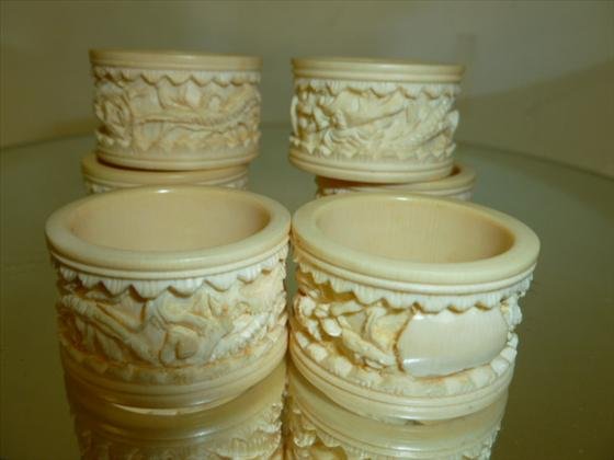 Set 6 oriental napkin rings-could be bone: Set 6 oriental napkin rings-carved dragon design could be bone-little over 1 1/4 across