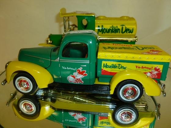 2 toy metal trucks-Mountain Dew: 2 toy metal trucks one is a banks- Mountain Dew-made by Golden-7 inch