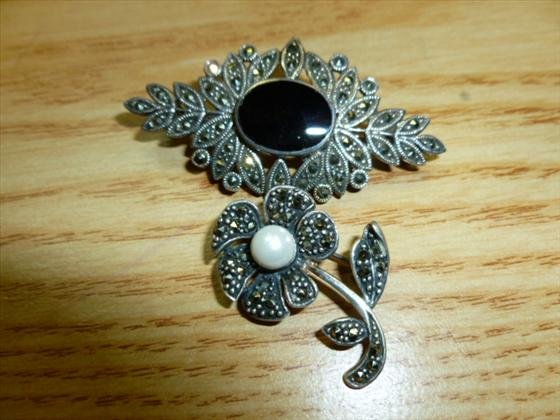 2 Sterling & marcasite brooches: 2 Sterling and marcasite,cultured pearl and onyx brooches- total . 45 troy oz
