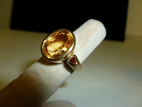 Gold filled sterling ring with yellow cz and garnet: Gold filled sterling ring with yellow cz and garnet- . 27 troy oz.