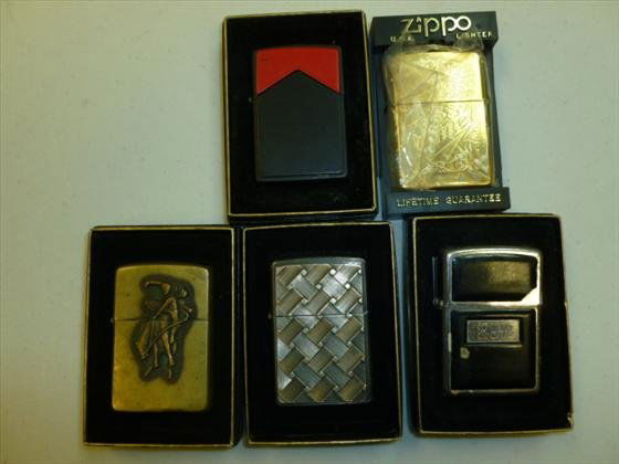 5 Zippo lighters with box: 5 Zippo lighters with box- brass silver tone -Camel etched- Ron black and silver- cowboy on horse -red design