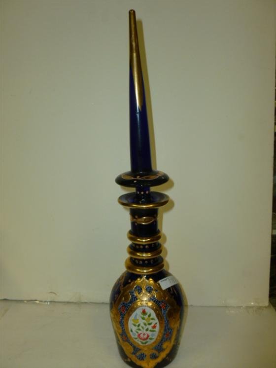 Cobalt blue bottle with long pointed stopper: Cobalt blue bottle with very long pointed stopper- Heavy gold design hand painted flowers-18 tall- Mosser style -real nice