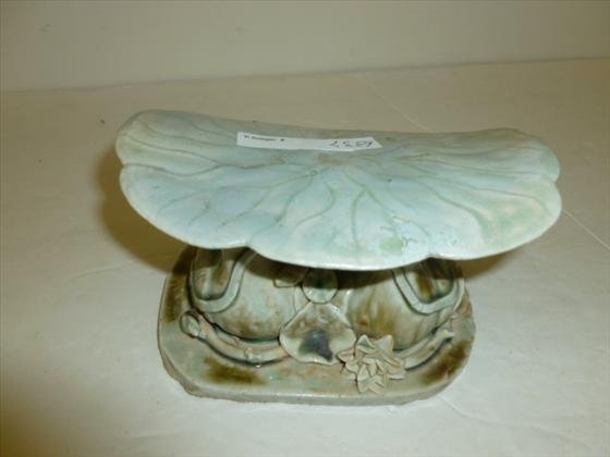 Oriental head read or pillow - porcelain: Oriental head read or pillow - porcelain - ducks with flowers sitting under a tole stool in green and tans in colors 3 1/2 tall - 6 long - Very unusual hard to find piece - don't miss this one