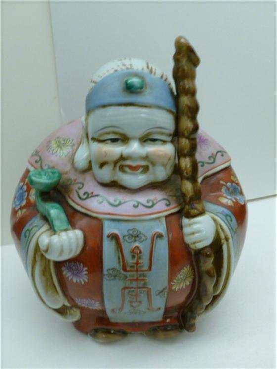 Fat round oriental king with scepter: Fat round oriental king with scepter and walking stick multi colors oriental dress - porcelain - 9 tall 8 dia