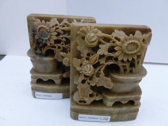 Set of soapstone bookends: Set of soapstone bookends carved flowers in basket light tan in color 5 x 4 in very good condition