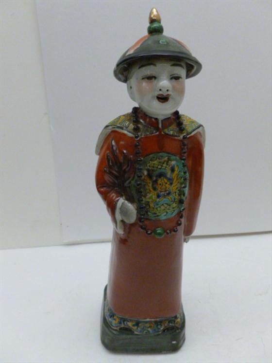Porcelain oriental man figurine: Porcelain oriental man figurine in red robe with beads long braid and coolie hat square base - 11 tall incised markings solid piece
