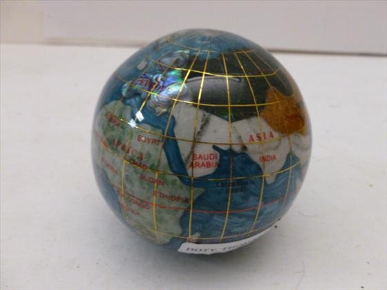 The world paperweight multi colored: The world paperweight multi colored with mother of pearl with gold trim round 3" tall good details of countries