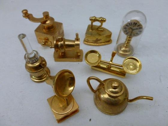 Lot of miniature brass doll house pieces: Lot of miniature brass doll house pieces 8 in all - oil lamp - iron - dome clock - phone - grinder - tea pot scale sewing machine all great shape - 1"