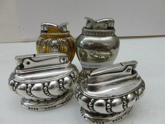 4 table lighters: 4 table lighters - Ronson crown - Evans - silver and gold tone all good condition - 2 1/2 to 3 1/2 tall