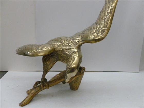 Brass eagle on olive branch: Brass eagle on olive branch wings spread - 17 across 15 high no marks or names -