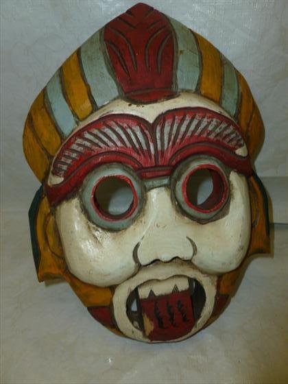 Hand carved wood mask made in Thailand: Hand carved wood mask made in Thailand #77-3281-11 1/2 long open eyes and mouth- red yellow blue and white in color hand Painted